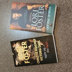 Two books by author Lori Foster. Titles  "Turn up the Heat" and "Getting Rowdy"